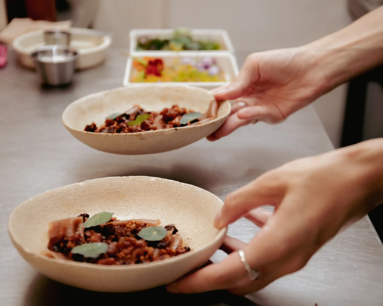 a finished plate, handed across the pass