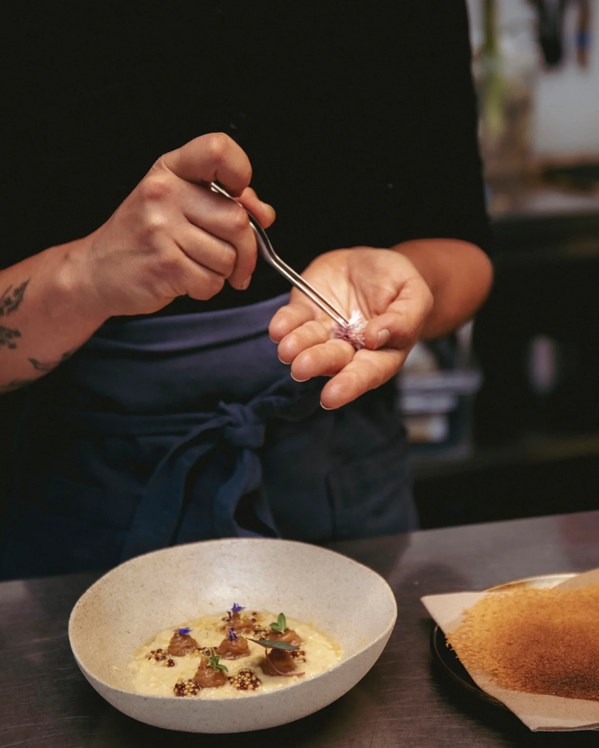 Monika plating a dish at VENN