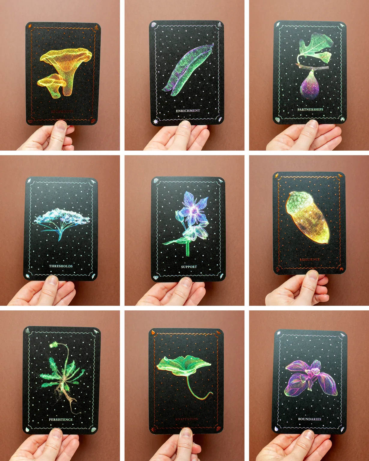 nine EAT.BITZ oracle cards, each held in one hand